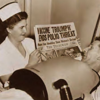Image of nurse holding up newspaper for patient to see